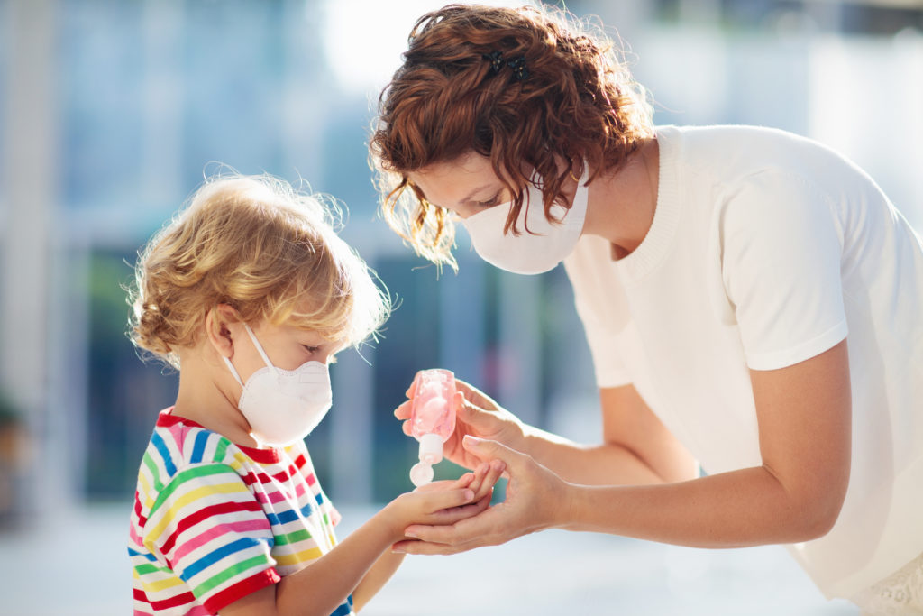 mother-and-child-with-face-mask-and-hand-sanitizer