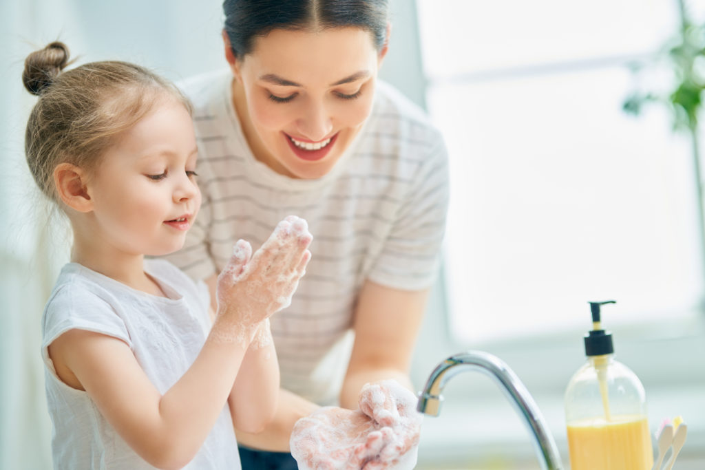 girl-and-her-mother-are-washing-hands