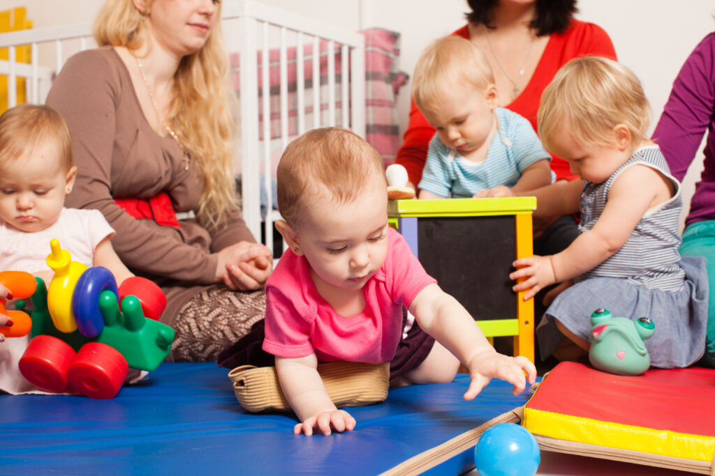 Babies play in a daycare.