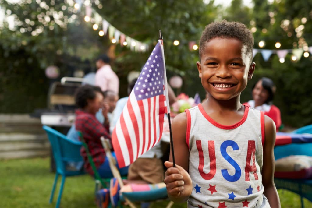 boy celebrates Fourth of July