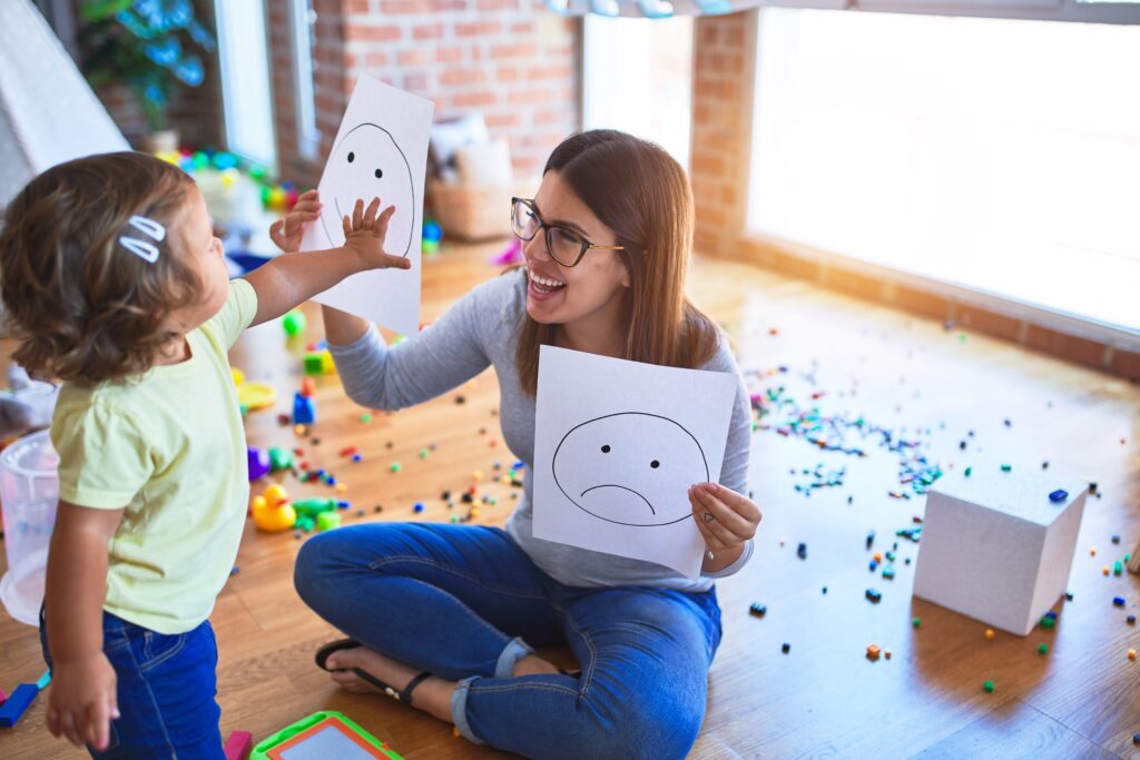 Teacher explains emotions and self-regulation to young girl.