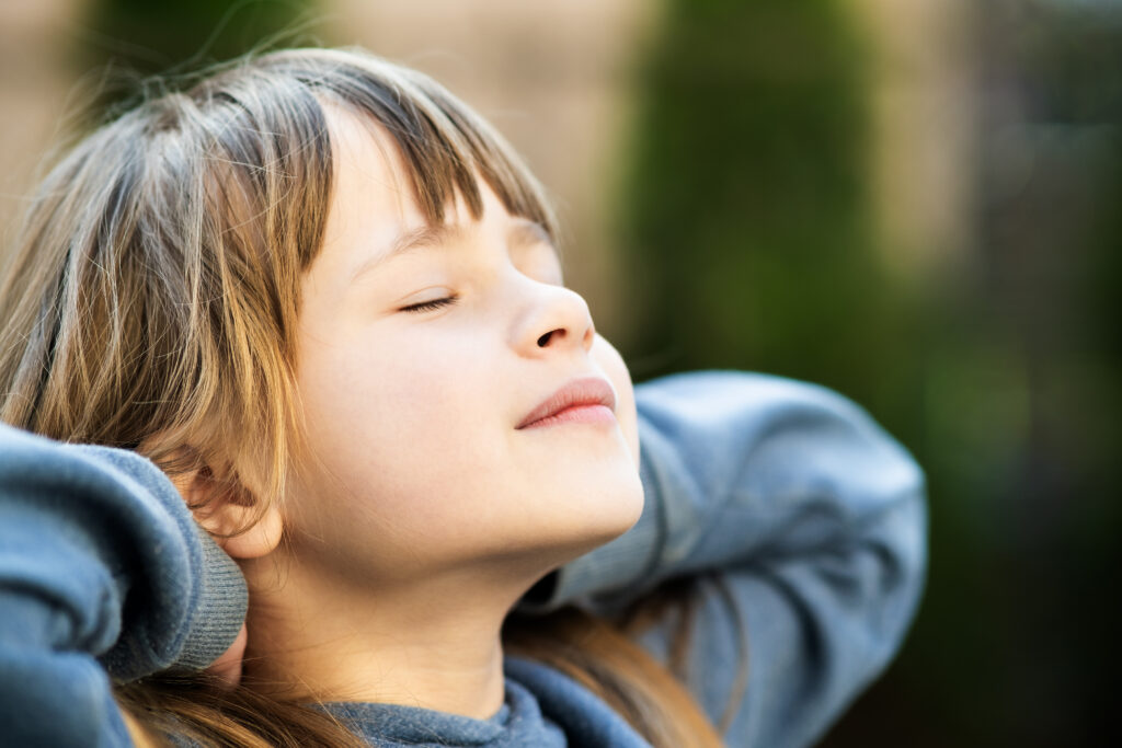 Child breathes deeply to calm down.