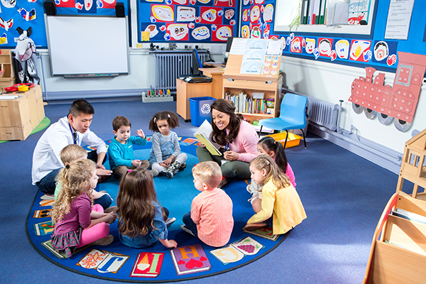 Preschool classroom does circle time.